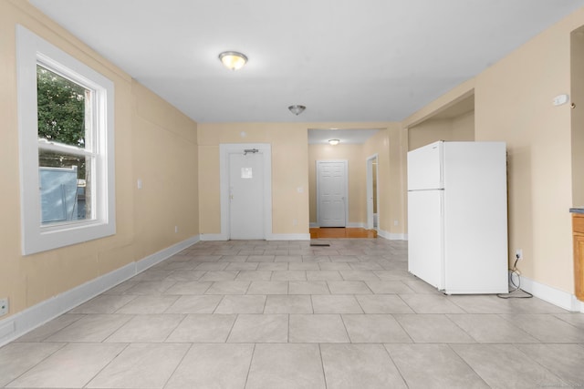 spare room with light tile patterned floors