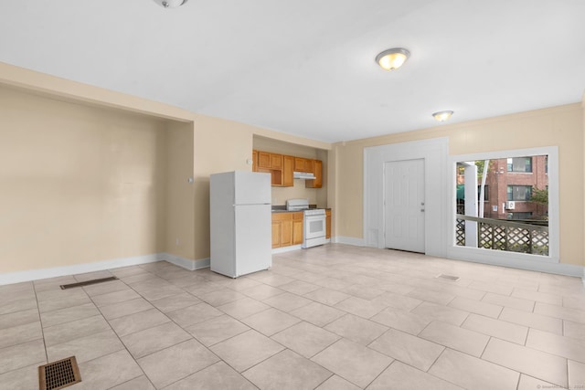 unfurnished living room featuring light tile patterned floors