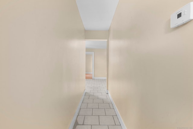 hallway featuring light tile patterned floors