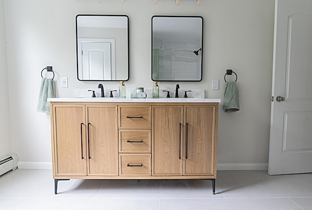 bathroom featuring vanity, a baseboard radiator, and tile patterned floors