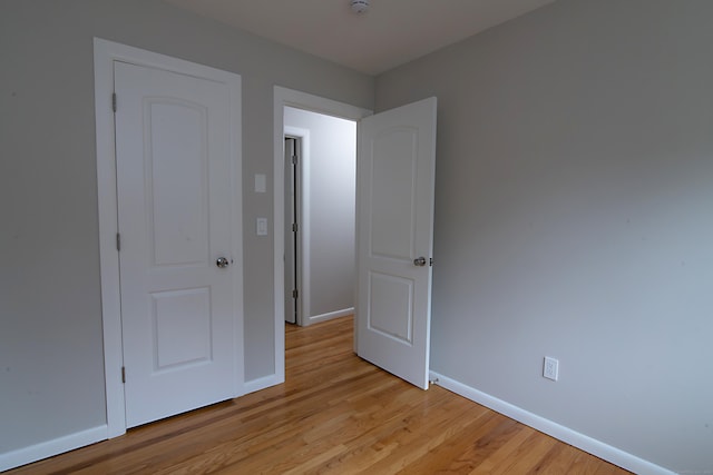 unfurnished bedroom with light hardwood / wood-style floors