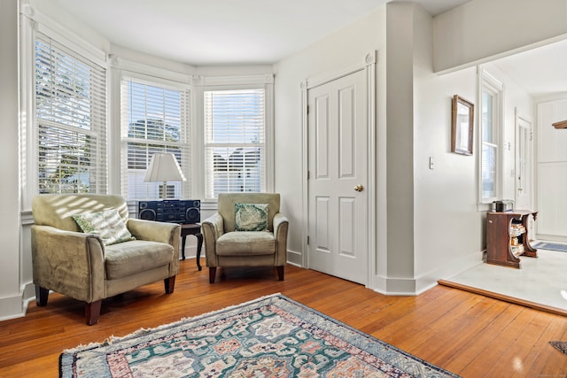 living area with hardwood / wood-style floors