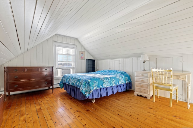 bedroom featuring cooling unit, wooden ceiling, hardwood / wood-style floors, and vaulted ceiling