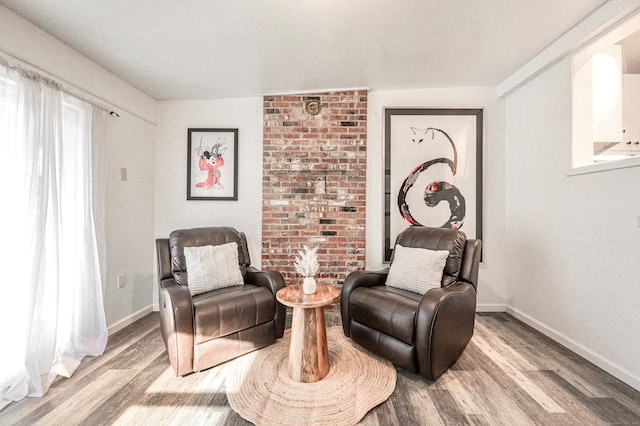 sitting room featuring hardwood / wood-style floors