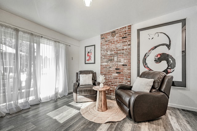 sitting room with dark hardwood / wood-style floors