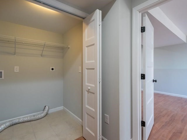 laundry room with light hardwood / wood-style flooring and electric dryer hookup