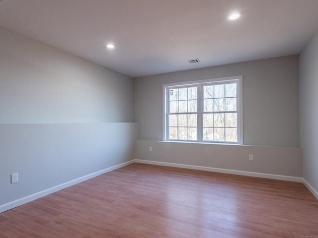 empty room with light wood-type flooring