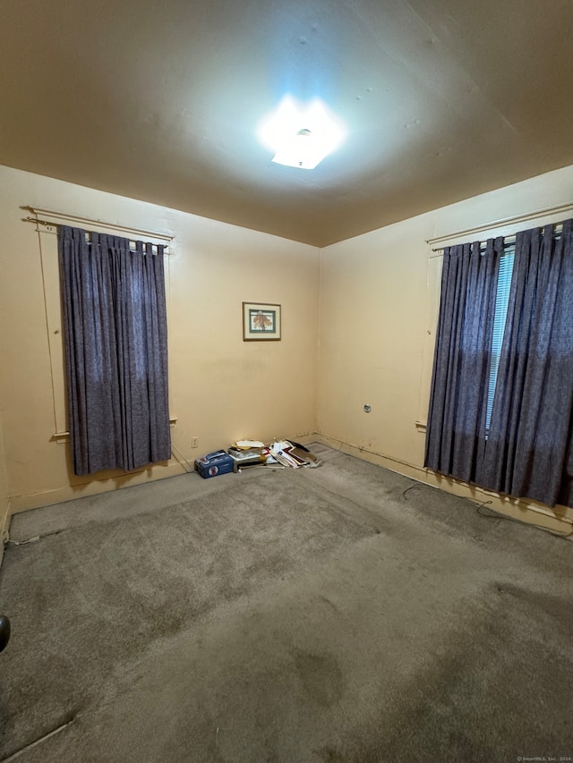 unfurnished room with carpet flooring