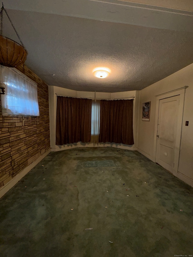 empty room with a textured ceiling