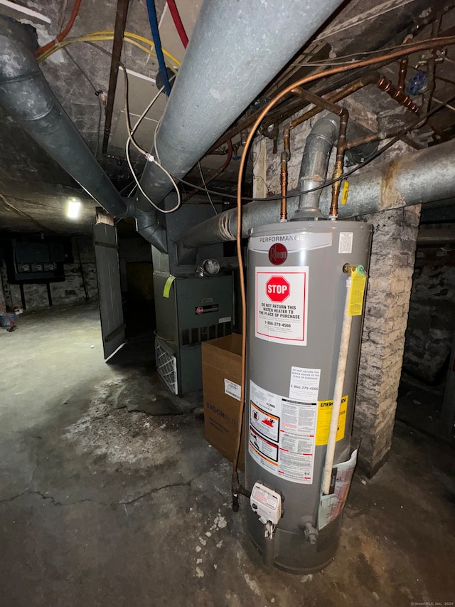 utility room with water heater