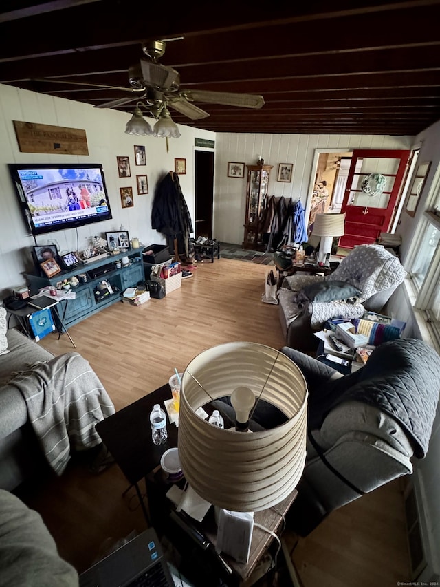 living area with ceiling fan and wood finished floors