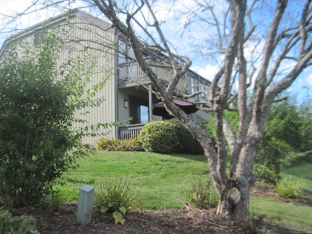 view of home's exterior with a yard