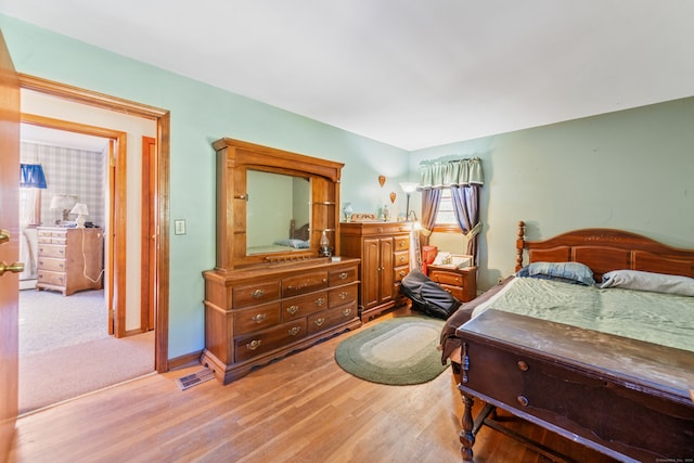 bedroom with hardwood / wood-style floors