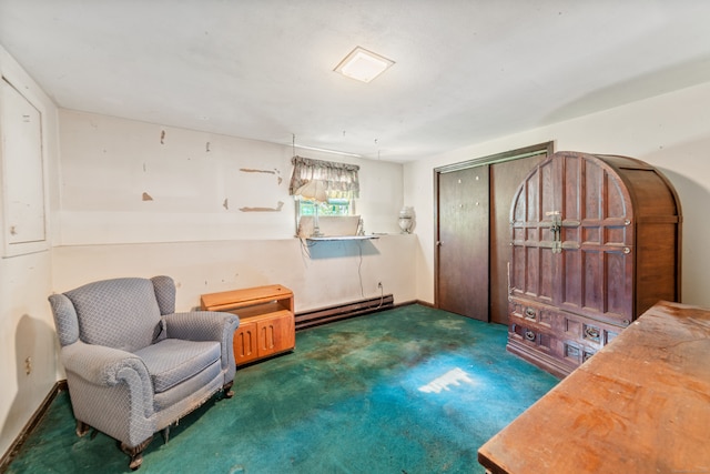 sitting room featuring dark colored carpet and baseboard heating