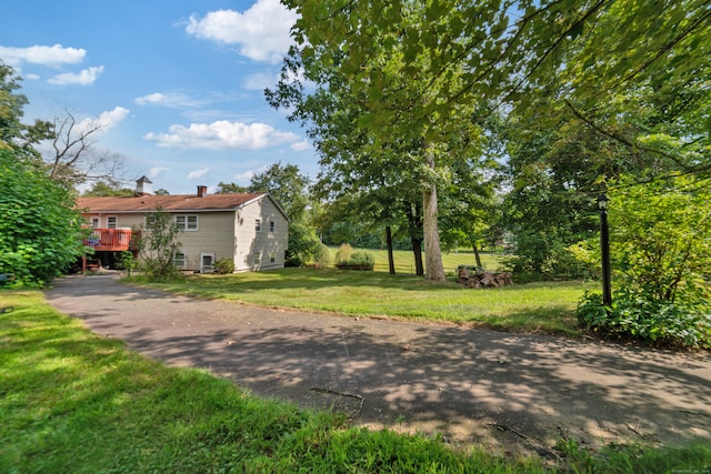 view of yard with a wooden deck