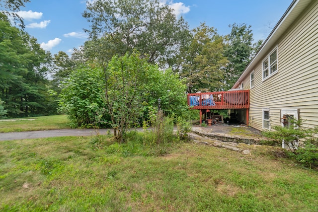 view of yard with a wooden deck