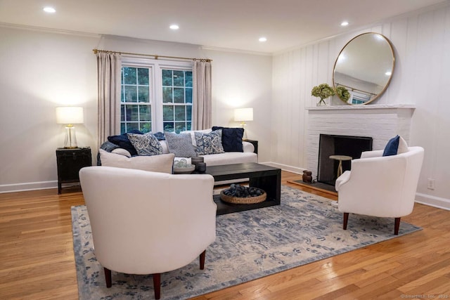 144 Hawks Hill Rd, New Canaan, CT 06840 - living room featuring crown molding, wood finished floors, a fireplace, and recessed lighting