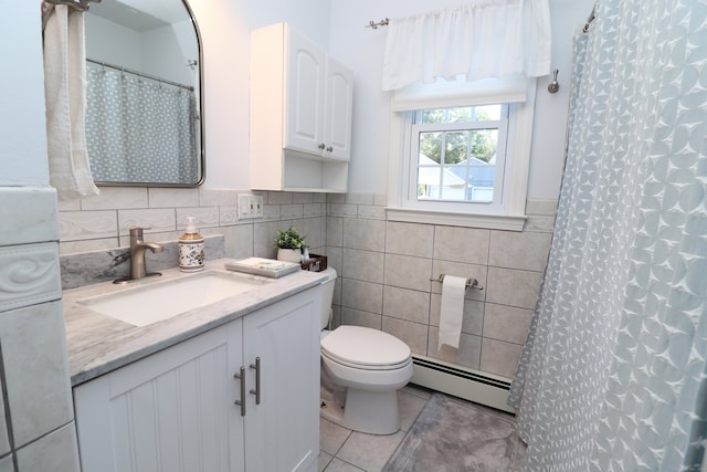 bathroom with tile patterned flooring, toilet, baseboard heating, tile walls, and vanity