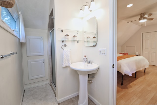 bathroom featuring an enclosed shower, vaulted ceiling, wood-type flooring, and ceiling fan