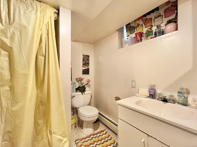 bathroom with tile patterned flooring, toilet, vanity, and a baseboard heating unit