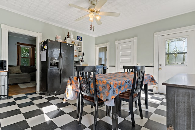 dining space featuring ceiling fan