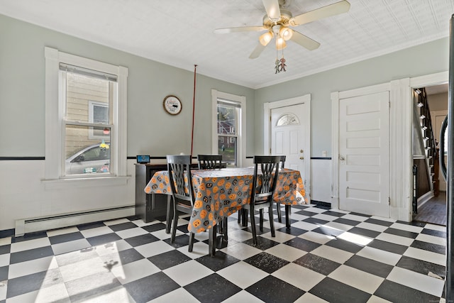 dining room featuring ceiling fan, ornamental molding, and a baseboard radiator