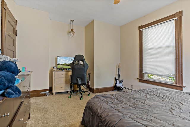 carpeted bedroom with ceiling fan