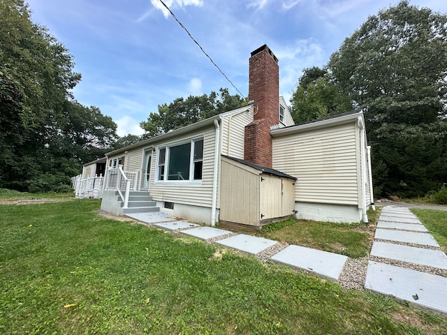 view of property exterior with a yard