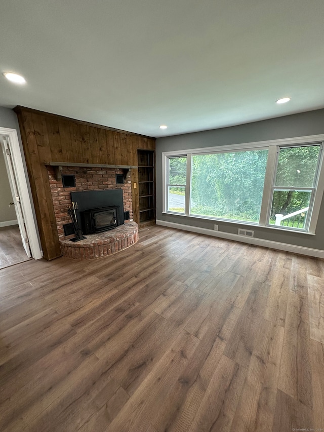 unfurnished living room featuring hardwood / wood-style floors