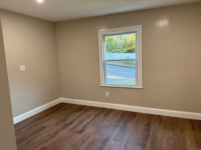 unfurnished room featuring dark hardwood / wood-style floors