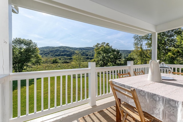 wooden deck with a yard