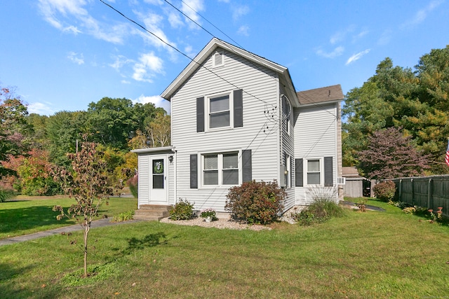 view of front of home with a front lawn