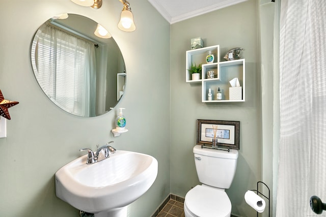 bathroom with crown molding, tile patterned floors, sink, and toilet