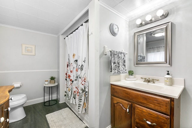 bathroom with vanity, toilet, walk in shower, crown molding, and hardwood / wood-style floors