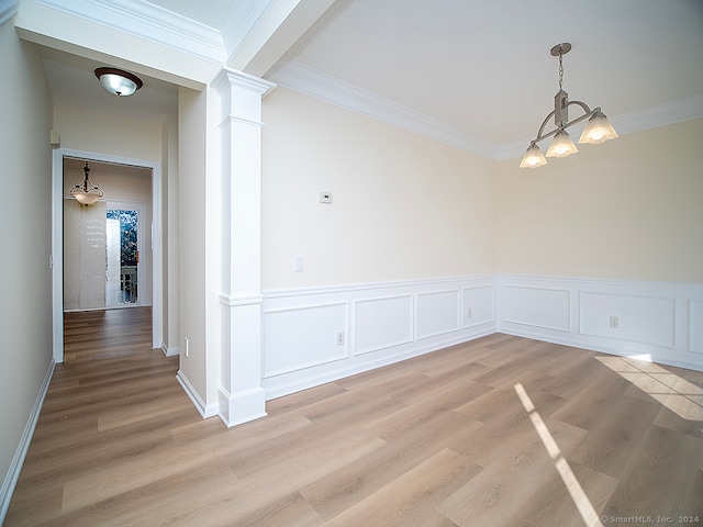 interior space featuring ornamental molding and light wood-type flooring