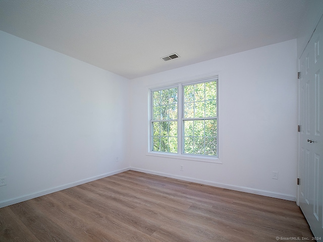 empty room featuring hardwood / wood-style floors