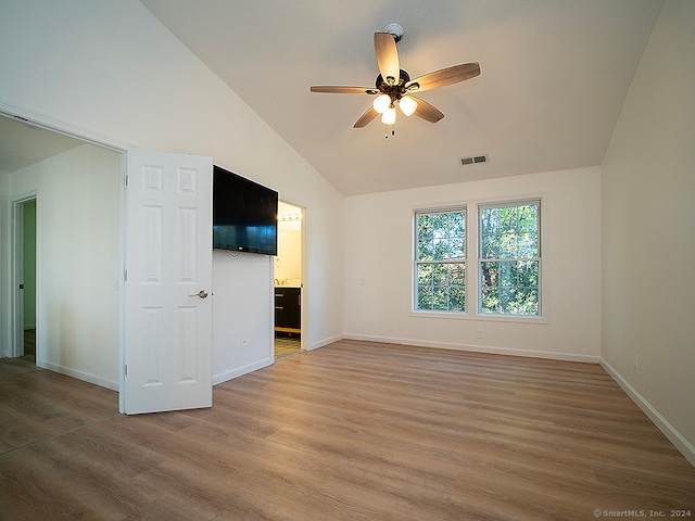 unfurnished living room featuring ceiling fan, hardwood / wood-style flooring, and lofted ceiling