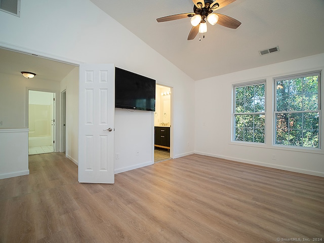 unfurnished living room featuring light wood-type flooring, ceiling fan, and vaulted ceiling