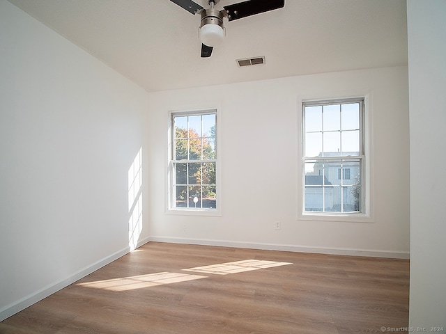 spare room with ceiling fan and light hardwood / wood-style floors