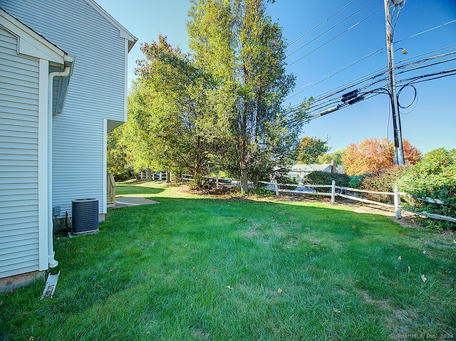 view of yard with central air condition unit