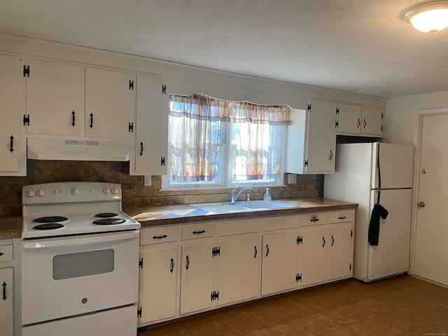 kitchen featuring white cabinets, white appliances, sink, and backsplash