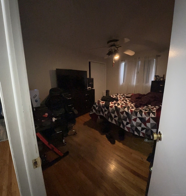 bedroom featuring hardwood / wood-style floors and ceiling fan