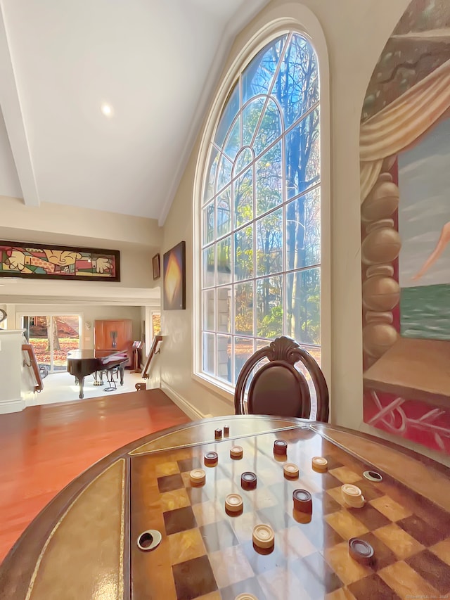 dining room featuring lofted ceiling