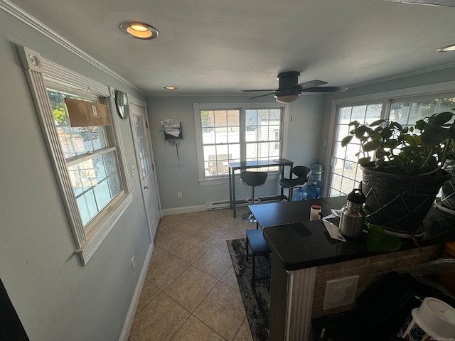 office featuring light tile patterned floors, crown molding, a wealth of natural light, and ceiling fan