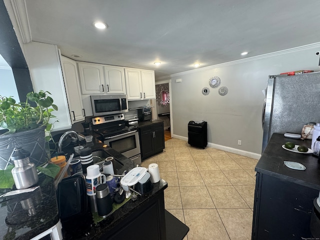 kitchen with crown molding, sink, white cabinets, appliances with stainless steel finishes, and light tile patterned floors