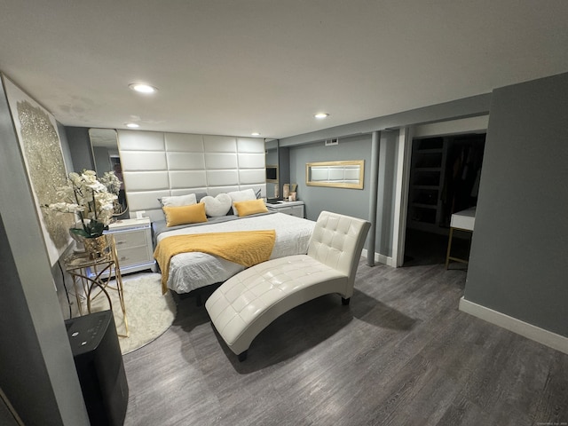 bedroom featuring dark hardwood / wood-style flooring