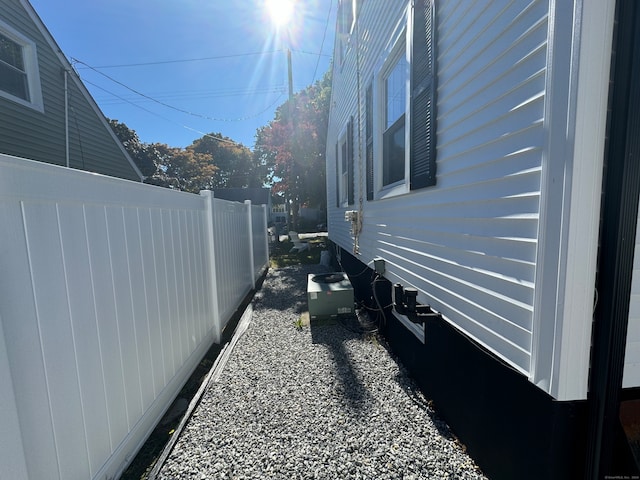 view of side of home featuring central air condition unit