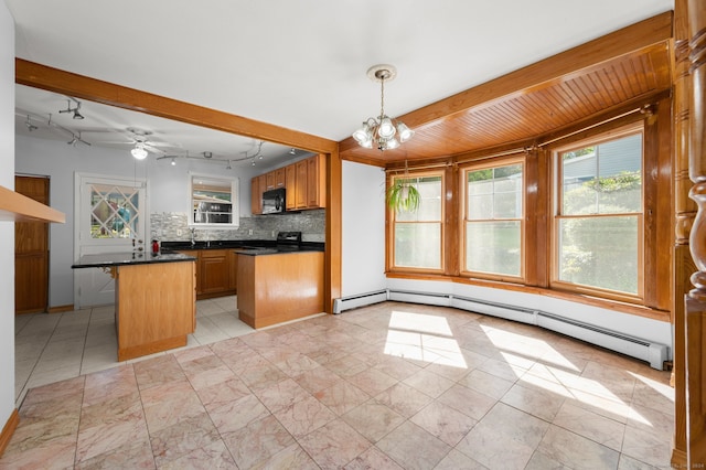 kitchen featuring hanging light fixtures, tasteful backsplash, a baseboard heating unit, black appliances, and ceiling fan with notable chandelier