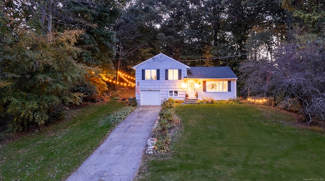 split level home featuring a garage and a front yard