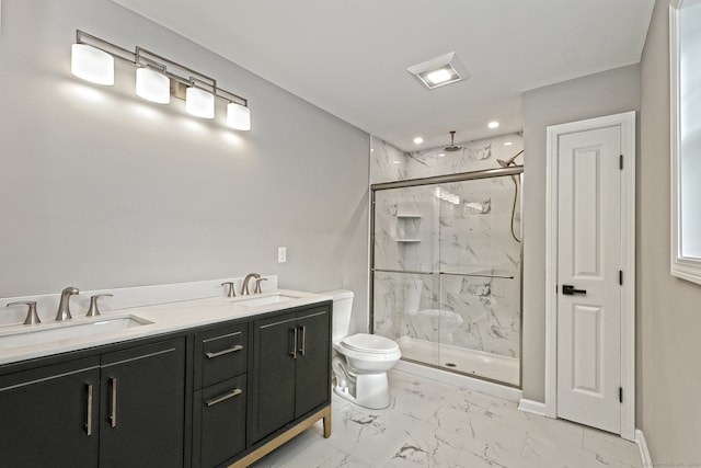 bathroom with vanity, toilet, and an enclosed shower